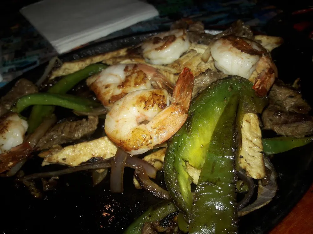 Steak Chicken and Shrimp Fajitas